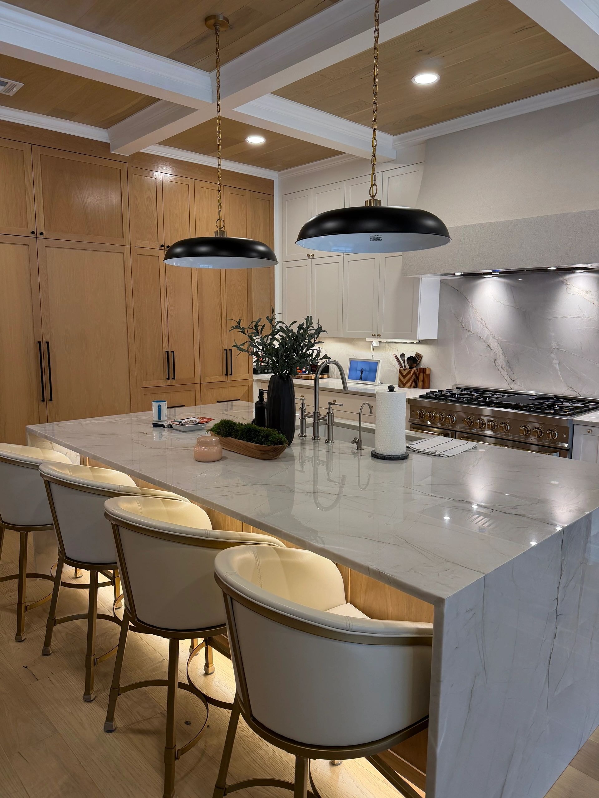 Custom kitchen with pendant lights and island